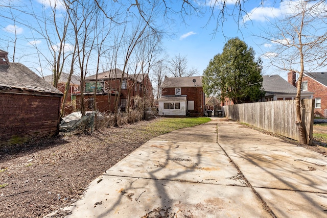 back of property featuring fence