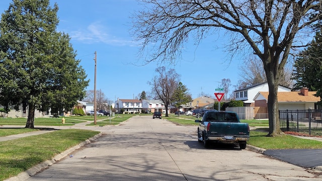 3508 Easthampton Dr, Flint, MI 48503 - view of road with curbs, sidewalks, and a residential view