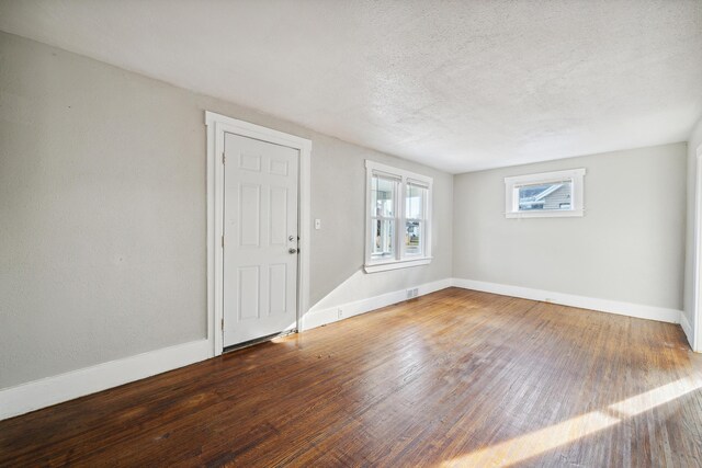 20035 Santa Barbara Dr, Detroit, MI 48221 - spare room featuring baseboards, a textured ceiling, and wood finished floors