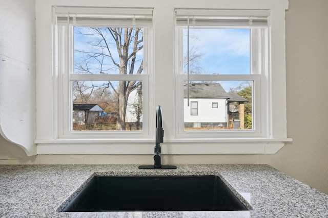 20035 Santa Barbara Dr, Detroit, MI 48221 - room details with a sink and light stone counters