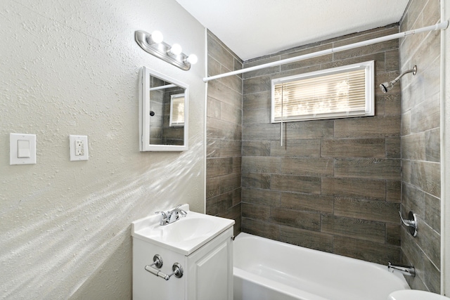 20035 Santa Barbara Dr, Detroit, MI 48221 - bathroom featuring vanity, a textured wall, and shower / washtub combination
