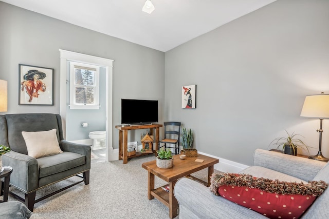 living room with baseboards and carpet floors