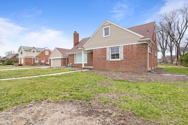 view of front facade featuring a garage, brick siding, a chimney, and a front lawn