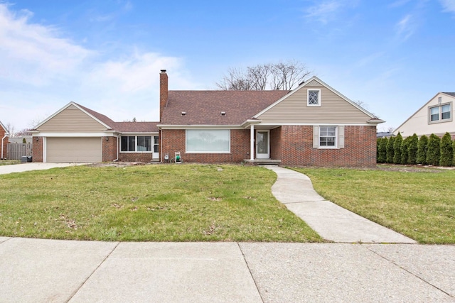 view of front of property featuring a garage, concrete driveway, a front lawn, and brick siding