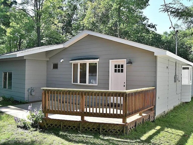 back of house with a deck