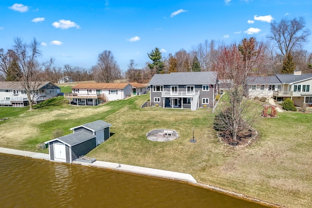 birds eye view of property with a residential view and a water view