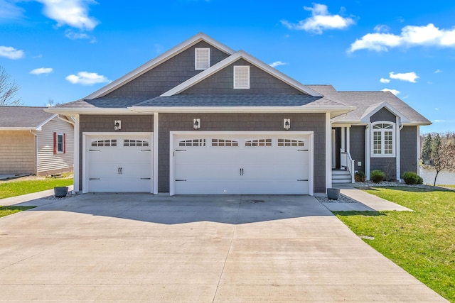 view of front of house featuring a front yard, roof with shingles, a garage, and concrete driveway