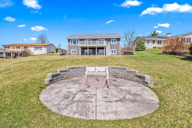 back of house with a wooden deck, stairs, and a lawn