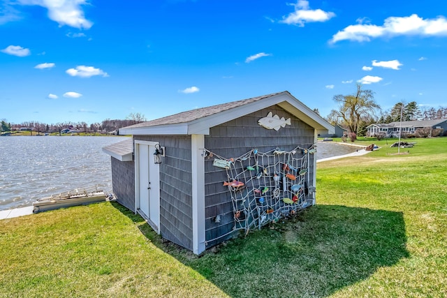 view of shed with a water view