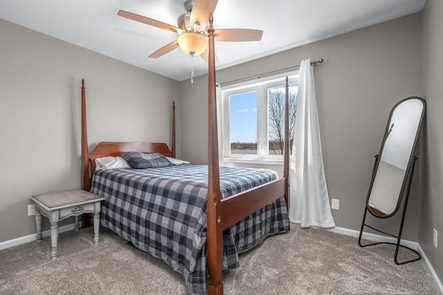 carpeted bedroom featuring a ceiling fan and baseboards