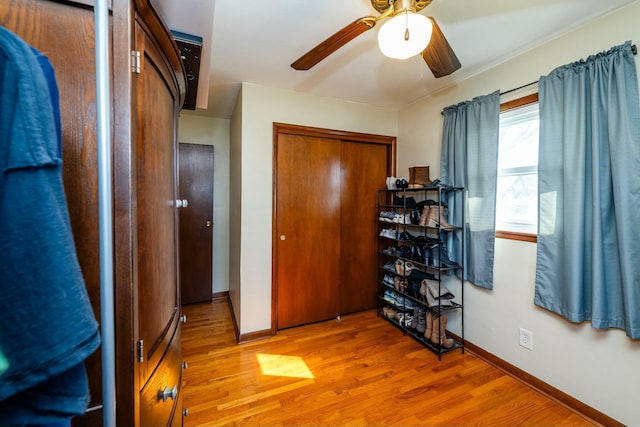 1373 Kingman Dr, Saint Joseph, MI 49085 - bedroom featuring baseboards, a closet, wood finished floors, and ceiling fan