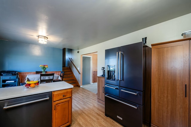 1373 Kingman Dr, Saint Joseph, MI 49085 - kitchen featuring light countertops, light wood-style floors, dishwashing machine, high quality fridge, and brown cabinetry
