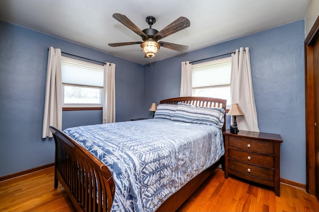 1373 Kingman Dr, Saint Joseph, MI 49085 - bedroom with baseboards, ceiling fan, and wood finished floors