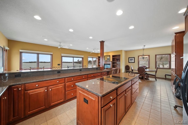 kitchen featuring a ceiling fan, a center island, black electric cooktop, recessed lighting, and light tile patterned flooring
