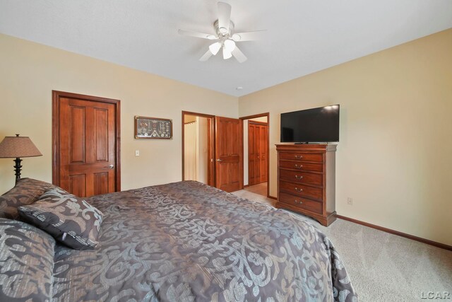 3387 Round Lake Hwy, Manitou Beach, MI 49253 - bedroom featuring light carpet, ceiling fan, and a closet