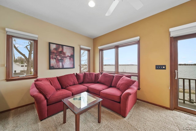 3387 Round Lake Hwy, Manitou Beach, MI 49253 - living area featuring a water view, carpet floors, and plenty of natural light