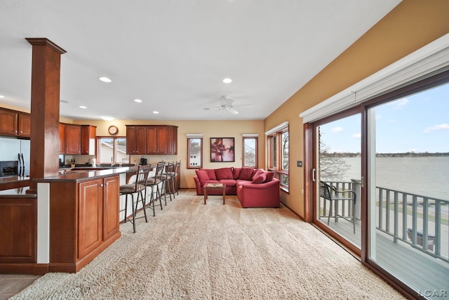 living room featuring recessed lighting, ceiling fan, and light colored carpet