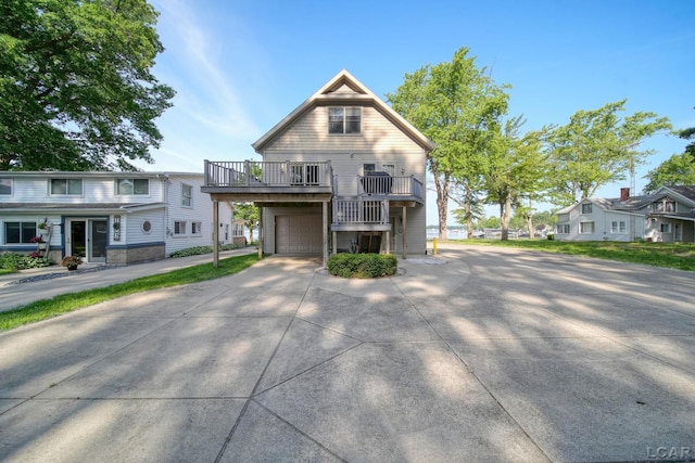 3387 Round Lake Hwy, Manitou Beach, MI 49253 - view of front of house with a garage, driveway, and a wooden deck