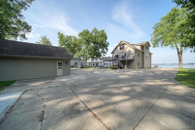 3387 Round Lake Hwy, Manitou Beach, MI 49253 - view of side of property featuring stairway and a water view