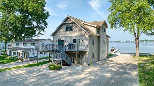 3387 Round Lake Hwy, Manitou Beach, MI 49253 - view of front of home with a deck with water view and stairway
