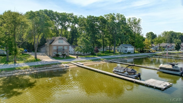 3387 Round Lake Hwy, Manitou Beach, MI 49253 - dock with a water view and view of wooded area