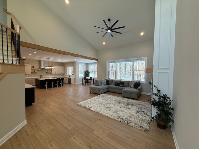 2323 Canterwood, Highland, MI 48357 - living room with a wealth of natural light, baseboards, light wood-style flooring, and high vaulted ceiling
