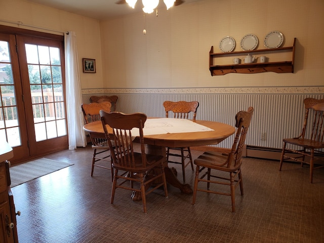 dining room featuring wallpapered walls and a ceiling fan