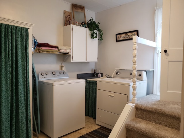 washroom with independent washer and dryer and laundry area