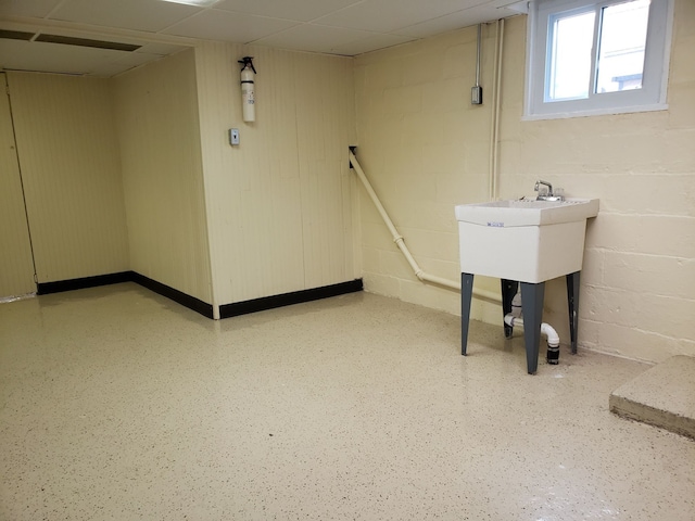 below grade area with concrete block wall