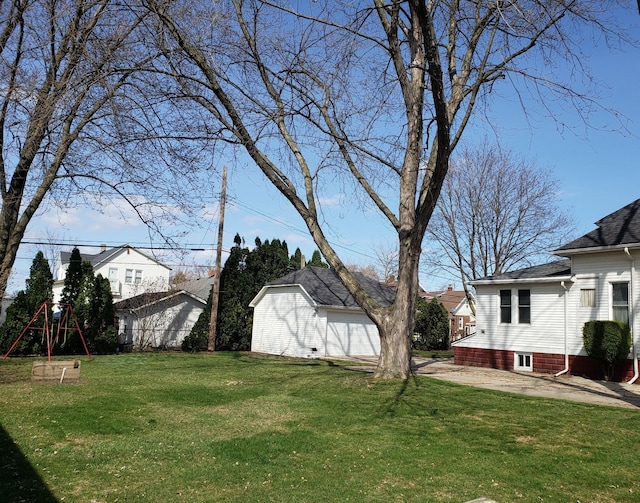view of yard featuring an outdoor structure and a playground