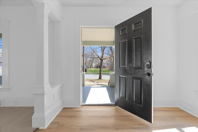 1026 S Jackson St, Jackson, MI 49203 - entrance foyer with ornate columns and wood finished floors