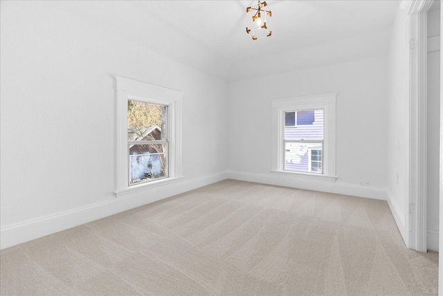 1026 S Jackson St, Jackson, MI 49203 - unfurnished room featuring baseboards, plenty of natural light, and light carpet