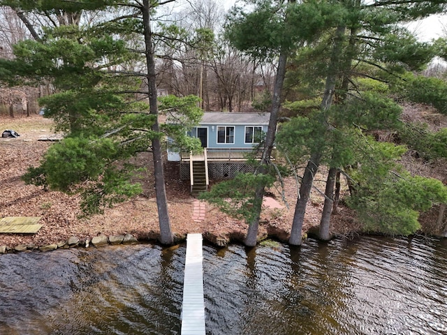 exterior space with a water view and stairway