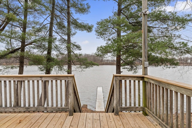wooden deck featuring a water view
