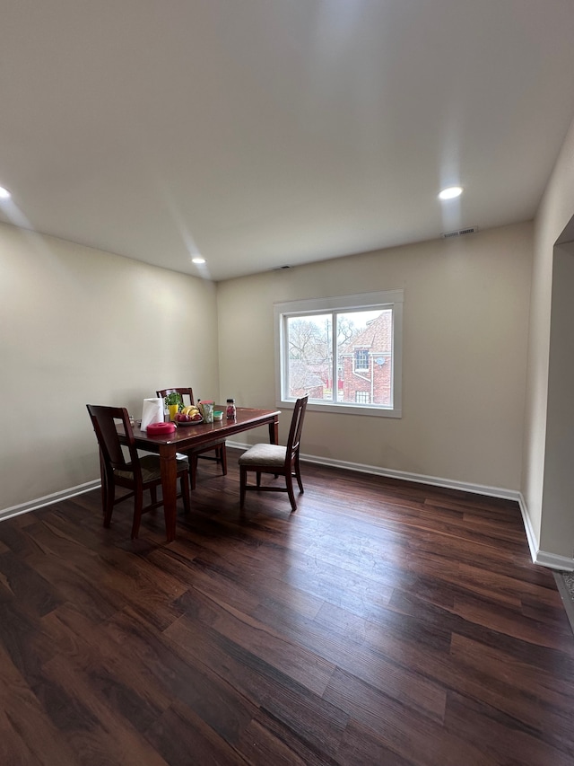 dining area featuring dark wood-style flooring, recessed lighting, baseboards, and visible vents