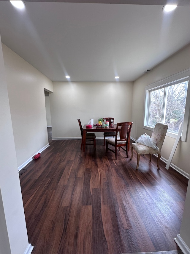 dining room featuring dark wood-style floors, baseboards, and recessed lighting