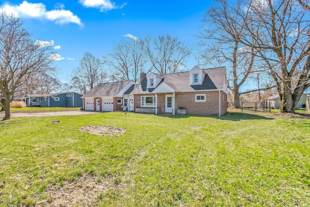 view of front facade featuring driveway, a front yard, fence, an attached garage, and brick siding