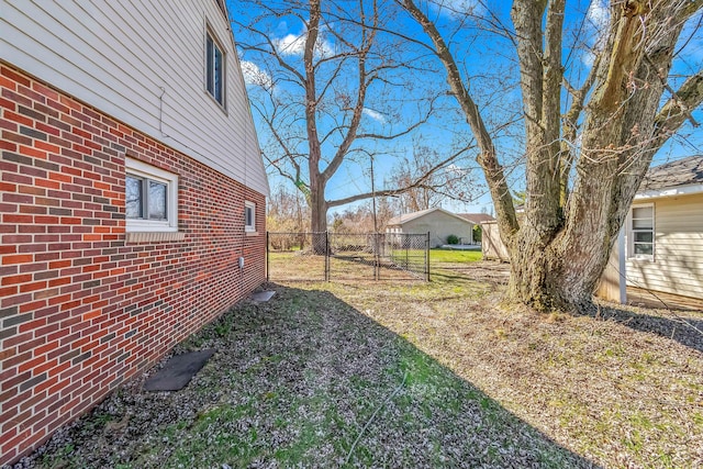 view of yard with a gate and fence