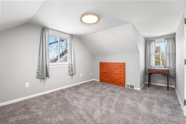 bonus room featuring carpet flooring, baseboards, vaulted ceiling, and visible vents