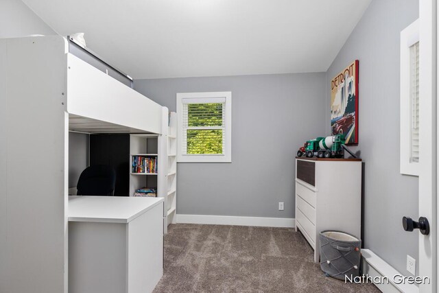 carpeted bedroom featuring baseboards