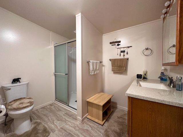 bathroom featuring vanity, baseboards, toilet, and a shower stall