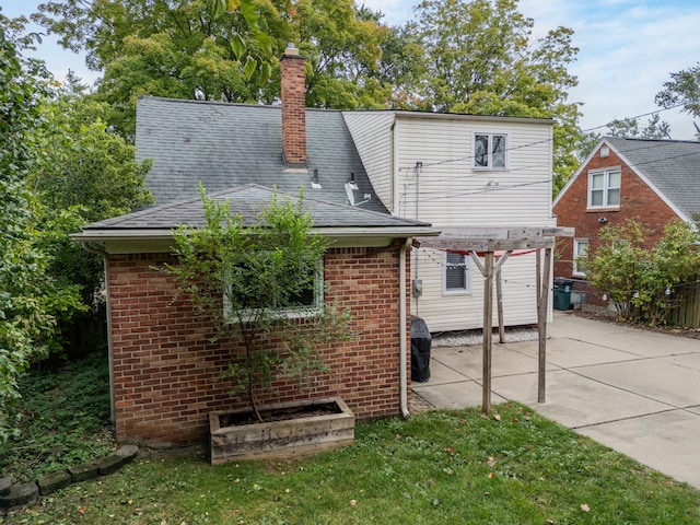 4423 Groveland Ave, Royal Oak, MI 48073 - back of property featuring a chimney, a pergola, a patio area, brick siding, and fence