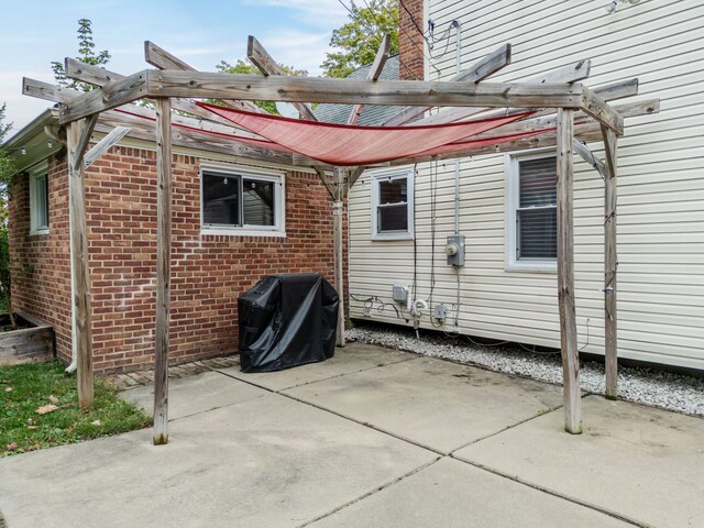 4423 Groveland Ave, Royal Oak, MI 48073 - rear view of property featuring a pergola, a patio, and brick siding