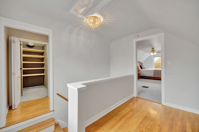 4423 Groveland Ave, Royal Oak, MI 48073 - hallway featuring visible vents, wood finished floors, lofted ceiling, an upstairs landing, and baseboards