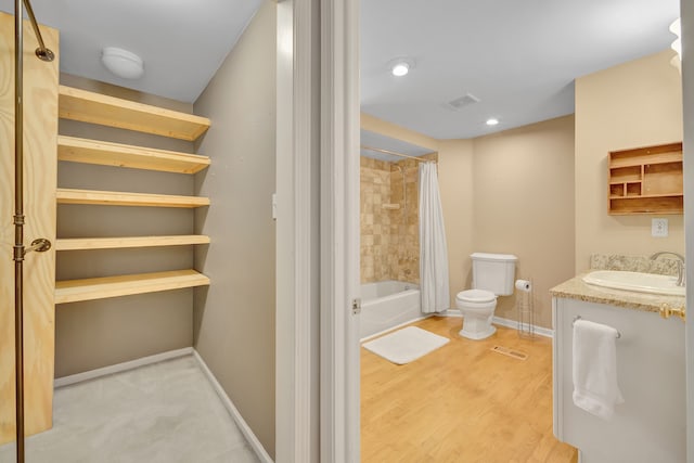 4423 Groveland Ave, Royal Oak, MI 48073 - full bathroom with baseboards, shower / bath combo, toilet, visible vents, and wood finished floors