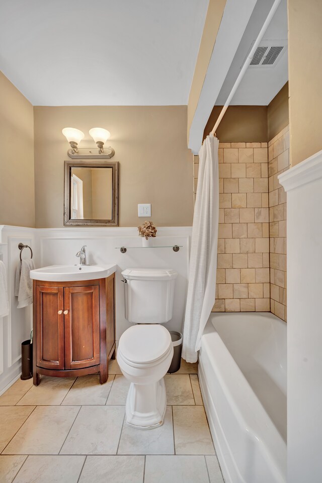 4423 Groveland Ave, Royal Oak, MI 48073 - full bathroom featuring vanity, tile patterned flooring, visible vents, toilet, and shower / bath combo with shower curtain