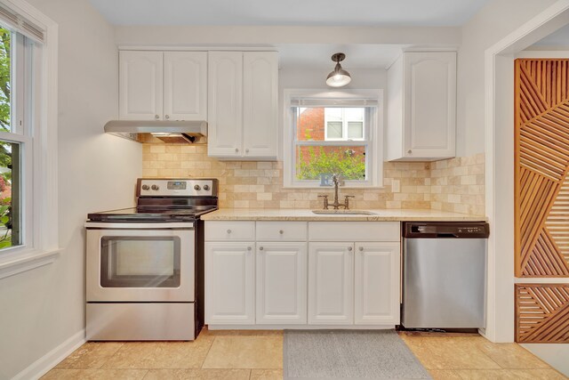 4423 Groveland Ave, Royal Oak, MI 48073 - kitchen featuring tasteful backsplash, white cabinets, a sink, appliances with stainless steel finishes, and under cabinet range hood