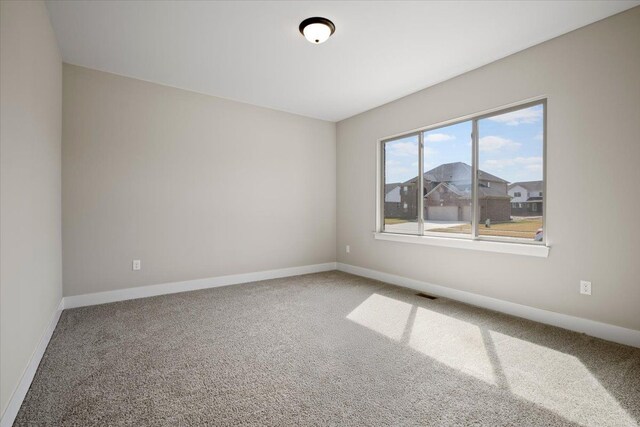 24599 Brookshire Dr, Macomb, MI 48042 - carpeted empty room with visible vents and baseboards