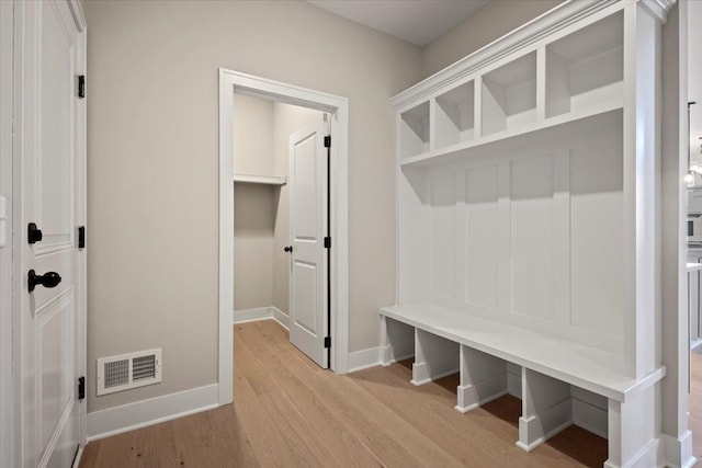 24599 Brookshire Dr, Macomb, MI 48042 - mudroom with visible vents, baseboards, and light wood-type flooring