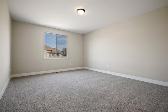 24599 Brookshire Dr, Macomb, MI 48042 - carpeted spare room with baseboards and visible vents